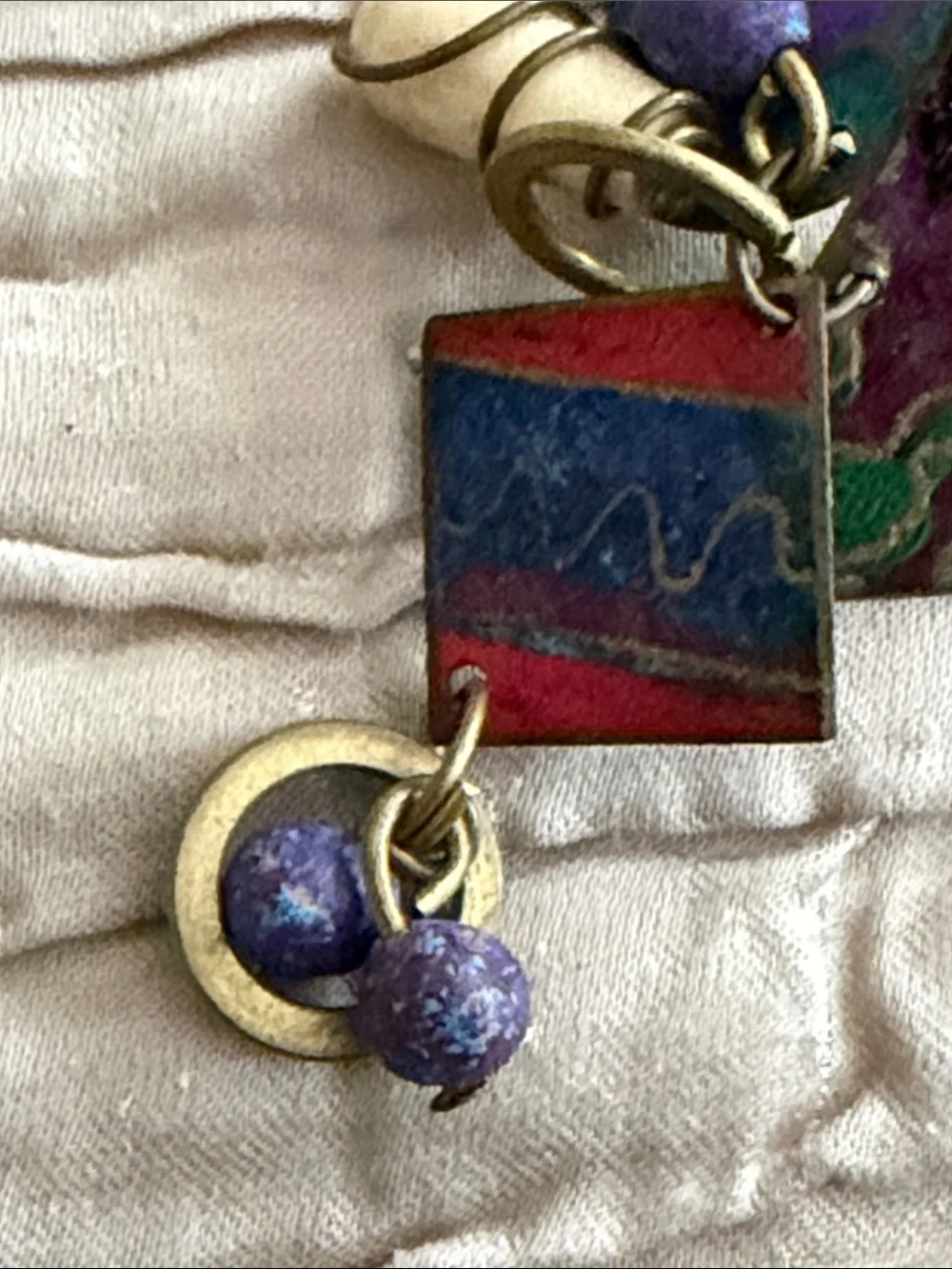 Clip style earrings artist made abstract metal pieces with attached panels